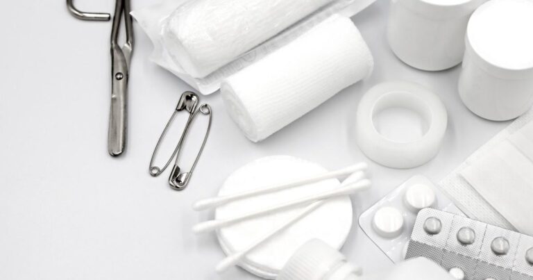 Contents of a survival first aid kit laid out flat